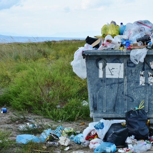 A photo of an overflowing garbage can