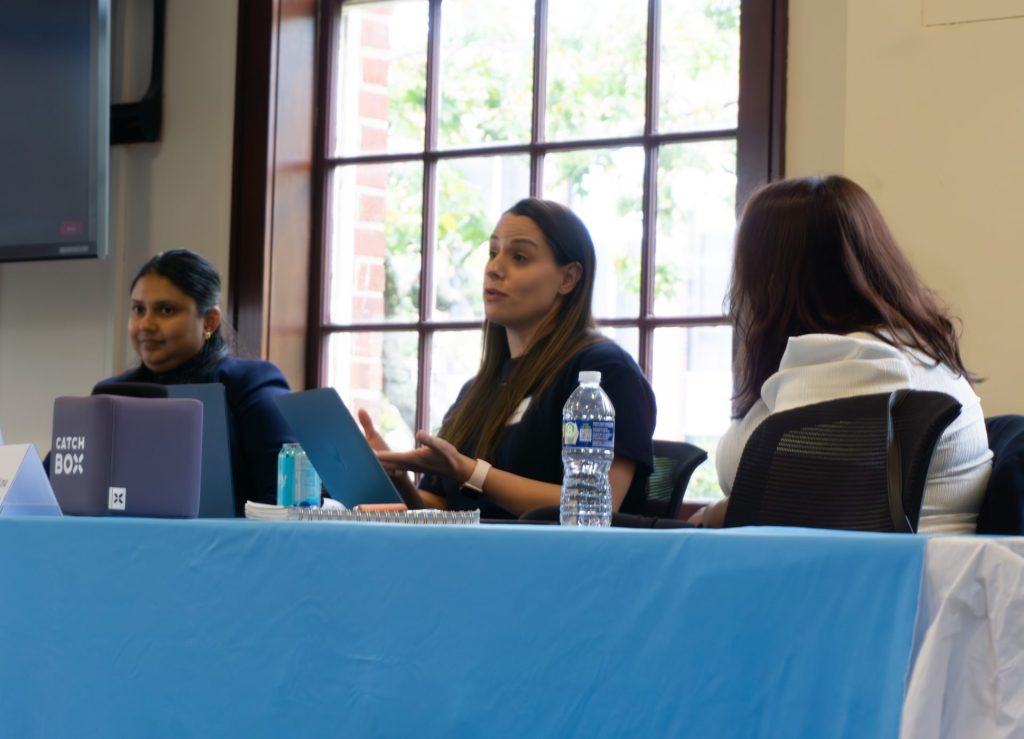 Robyn Caplan, Nanditha Narayanamoorthy, and Syeda Zainab Akbar Lnu talking during Panel 2.