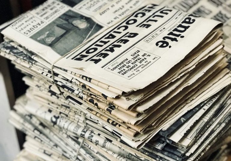Stock image of stacked newspapers